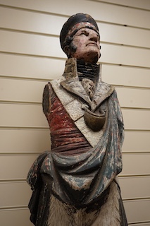 A large 19th century carved and painted Highlander ‘Snuff’ shop advertising figure. 109cm high. Condition - paint work and base weathered, arms detached.